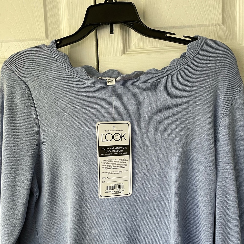 Light blue sweater/top.